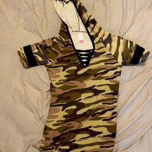 It is a camo shirt. It is low cut. It is a hoodie shirt. It is a polyester shirt